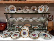A large lot of plates and dishes depicting fruit