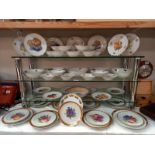 A large lot of plates and dishes depicting fruit