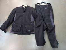 A Triumph motorcycle jacket size L and trousers size 36