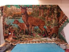 A large wall hanging tapestry wool work of deers