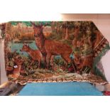 A large wall hanging tapestry wool work of deers