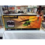 A boxed E Sky honey bee V2 RC helicopter. Looks complete, untested/ unchecked.