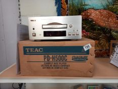 A boxed Teal PD-H500L compact disc player