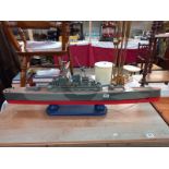 A large solid wooden scratch built model of a battleship Length 113cm collect only