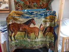 A large wall hanging tapestry wool work of horses