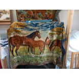 A large wall hanging tapestry wool work of horses