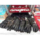 A selection of used motorcycle gloves, size L and XL