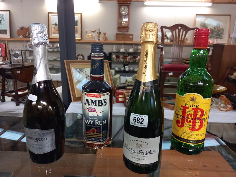 4 bottles including Lambs Navy Rum, J7B Scotch Whiskey, Nicolas Feuillatte champagne and prosecco.