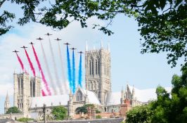 Red Arrows Over Lincoln Cathedral - A framed and glazed photograph by Chris Burke (Donated by