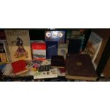 A shelf of books in cluding The Two Ronnies