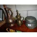 Three old copper jugs etc.,