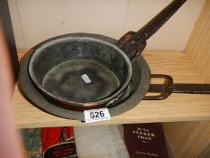 Two cast iron frying pans.