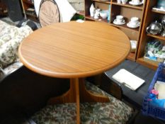 A small circular teak side table. COLLECT ONLY.