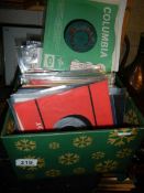 A box of 45 rpm records, Beatles, Hendrix, mostly 1960's.