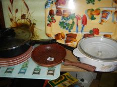 A shelf of kitchen ware.