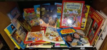 A shelf of children's books including Worzel Gummidge & Tiswas book