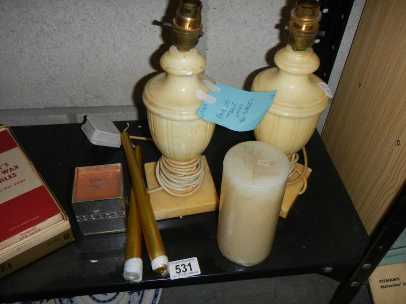 A pair of table lamp bases, candles etc.,