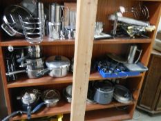 A large mixed lot of metalware - teapots, pans etc.,