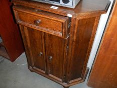 An oak two door cupboard with single drawer. COLLECT ONLY.