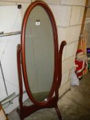 A mahogany cheval mirror. COLLECT ONLY.