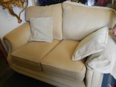 A good two seat sofa on brass castors, COLLECT ONLY,.