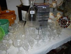 A decanter and several sets of glasses. COLLECT ONLY.