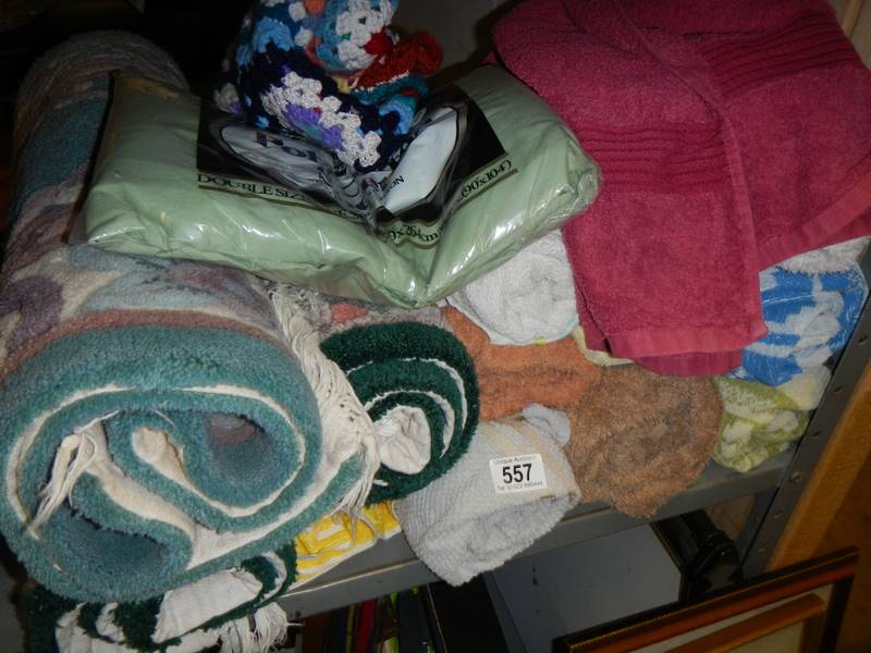 A mixed lot of rugs and towels. COLLECT ONLY.