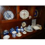 A mixed lot of blue and white plates, jugs, bowls etc., including Willow Pattern.