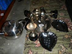 A shelf of assorted plated ware.