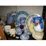 A shelf of assorted ceramics.