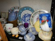 A shelf of assorted ceramics.