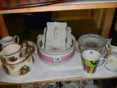 A shelf of assorted ceramics.