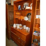 A teak four drawer dresser. COLLECT ONLY.