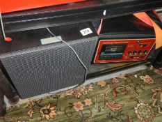 A vintage Coomber radio mic PA and Coomber speaker both with bacs.