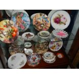 Two shelves of ceramic plates etc.,