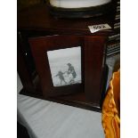 A mahogany photograph box.