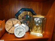 A quantity of clocks including anniversary.
