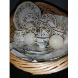 A basket of assorted tea ware.