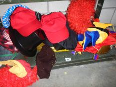 A shelf of fancy dress hats.