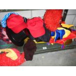 A shelf of fancy dress hats.