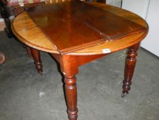 An old mahogany extending table with two leaves, COLLECT ONLY.