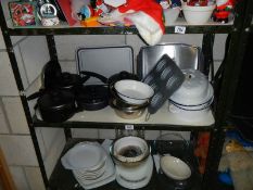 Two shelves of assorted kitchen ware.