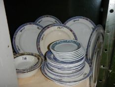 A quantity of dinner ware.