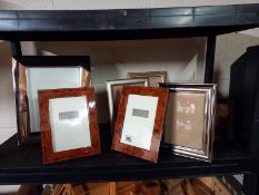 A mixed lot of photo frames.