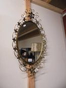 A vintage wrought iron framed mirror. COLLECT ONLY.