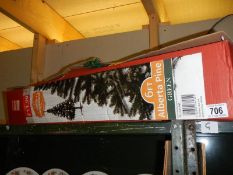 A 6ft Alberta pine green Christmas tree.
