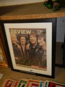 A framed and glazed newspaper page featuring The Rolling Stones.
