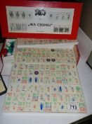 A Mahjong set and a set of dominoes.