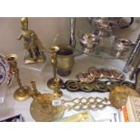 A mixed lot of brass ware including candlesticks, skimmers, horse brasses etc.,