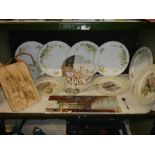 A shelf of assorted plates etc.,